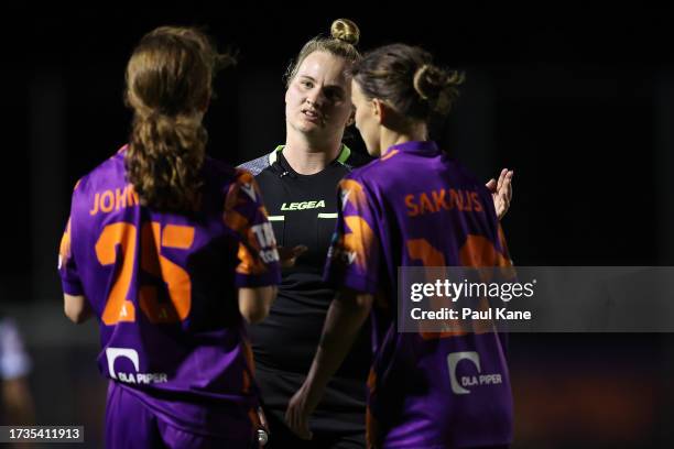 Referee Izzy Blaess talks with Grace Johnston and Sofia Sakalis of the Glory during the round one A-League Women match between Perth Glory and...