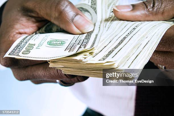 hands with money series - african american money stock pictures, royalty-free photos & images