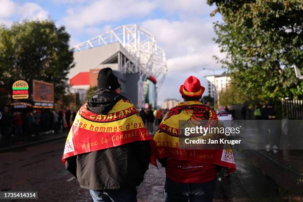 Catalans Dragons fans make their way to the stadium prior to the Betfred Super League Final match between Wigan Warriors v Catalans Dragons at Old...