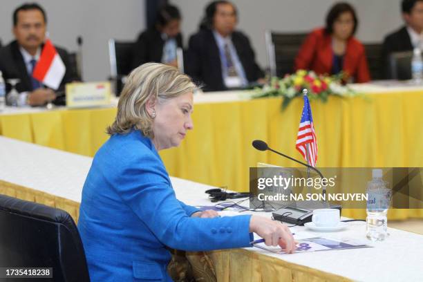 Secretary of State Hillary Clinton reads a document as she attends the US-ASEAN Ministerial Meeting in Hanoi on July 22, 2010. North Korea on...