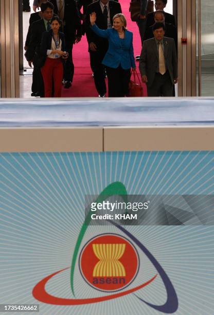 Secretary of State Hillary Clinton waves to the media upon her arrival at the National Convention Center in Hanoi on July 22, 2010. North Korea...
