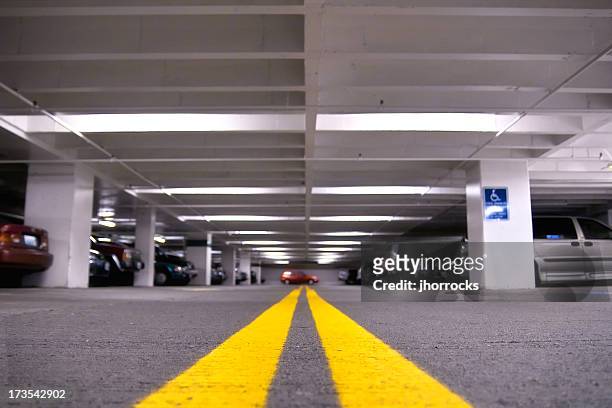 parking garage - yellow line stockfoto's en -beelden