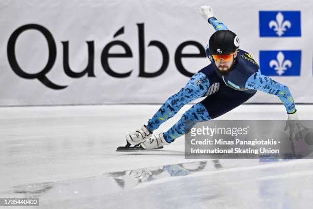 Denis Nikisha of Kazakhstan competes in the men's 500 m heats during the ISU World Cup Short Track at Maurice Richard Arena on October 20, 2023 in...