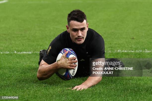 New Zealand's centre Will Jordan scores a try during the France 2023 Rugby World Cup semi-final match between Argentina and New Zealand at the Stade...