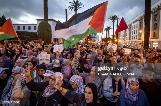 Moroccans wave the Palestinian flag during a gathering in Rabat on October 20, 2023 in support of Palestinians in the Gaza Strip amid the ongoing...