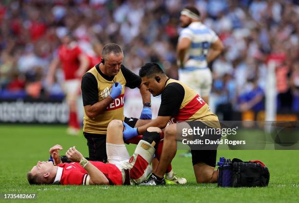 Liam Williams of Wales receives medical treatment to an injury during the Rugby World Cup France 2023 Quarter Final match between Wales and Argentina...