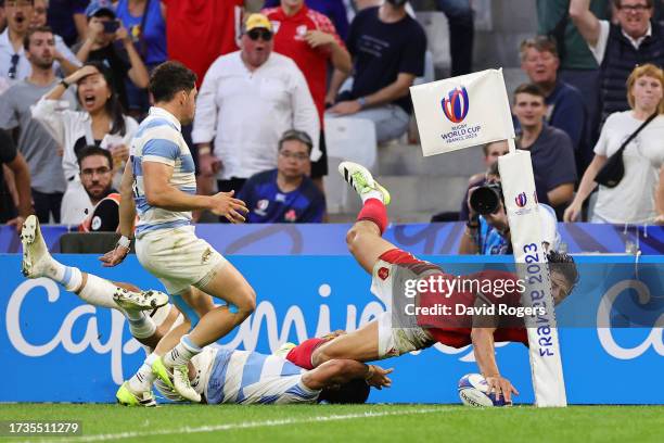 Louis Rees-Zammit of Wales is tackled by Matias Moroni of Argentina during the Rugby World Cup France 2023 Quarter Final match between Wales and...