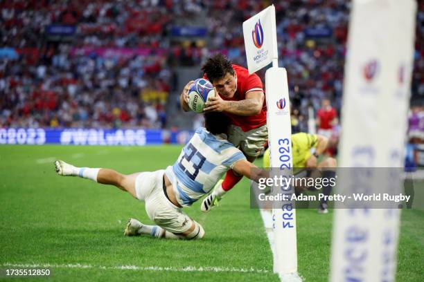 Louis Rees-Zammit of Wales is tackled by Matias Moroni of Argentina during the Rugby World Cup France 2023 Quarter Final match between Wales and...