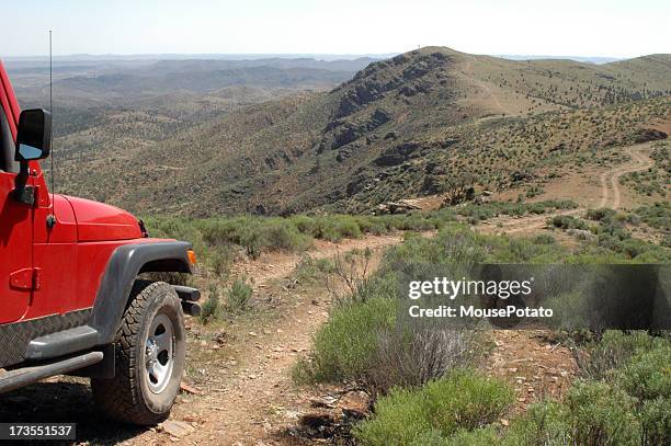 a red 4x4 vehicle driving in the flinders ranges - atv trail stock pictures, royalty-free photos & images