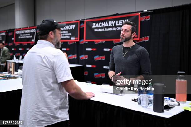 Zachary Levi signs autographs during New York Comic Con 2023 - Day 3 at Javits Center on October 14, 2023 in New York City.