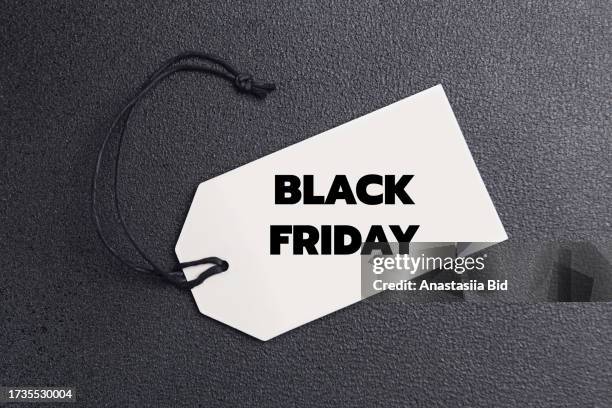 top view of label with black friday lettering. - bid offer stock pictures, royalty-free photos & images