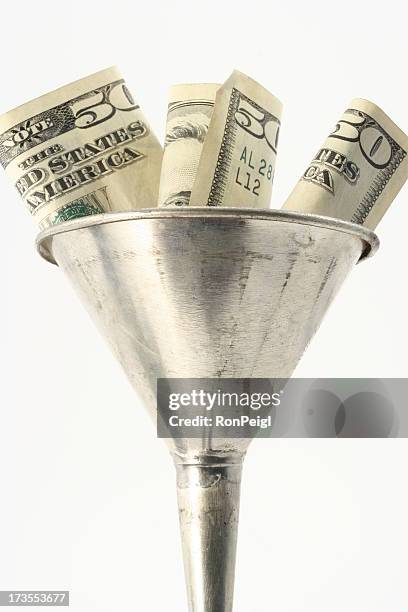 funneling currency - funnel stock pictures, royalty-free photos & images