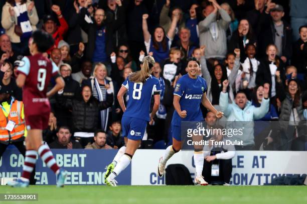 Sam Kerr of Chelsea celebrates with Melanie Leupolz after scoring the team's first goal during the Barclays Women's Super League match between...