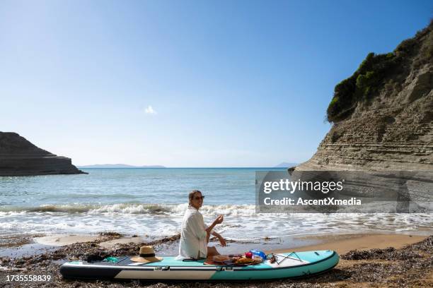 paddleboarding in the greek islands - corfu stock pictures, royalty-free photos & images