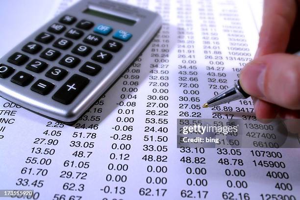 going over the numbers - cashflow stock pictures, royalty-free photos & images