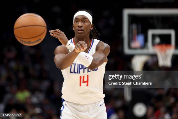 Terance Mann of the LA Clippers dribbles against the Utah Jazz during the third quarter of the Rain City Showcase in a preseason NBA game at Climate...