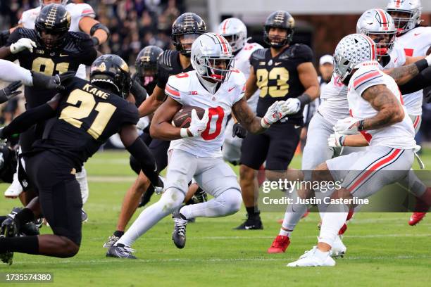 Xavier Johnson of the Ohio State Buckeyes runs the ball against the Purdue Boilermakers during the first half at Ross-Ade Stadium on October 14, 2023...