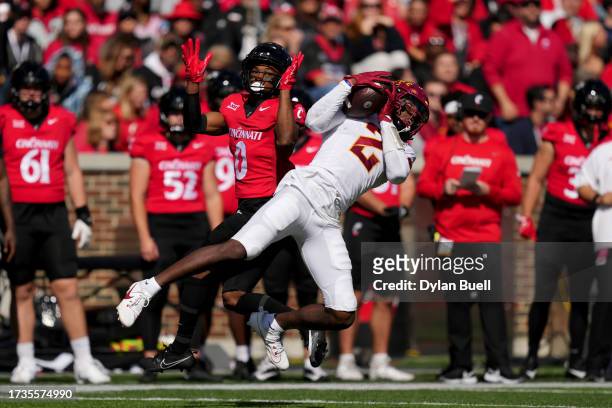 Tampa of the Iowa State Cyclones makes an interception in front of Braden Smith of the Cincinnati Bearcats in the first quarter at Nippert Stadium on...