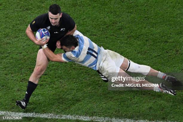 New Zealand's right wing Will Jordan is tackled by Argentina's left wing Mateo Carreras during the France 2023 Rugby World Cup semi-final match...