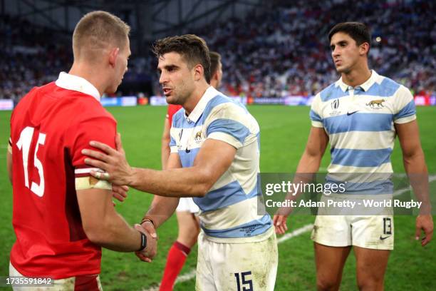 Liam Williams of Wales shakes hands with Juan Cruz Mallia of Argentina during the Rugby World Cup France 2023 Quarter Final match between Wales and...