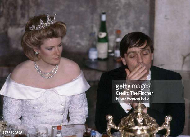Gerald Grosvenor, The 6th Duke of Westminster , and his wife, Natalia Duchess of Westminster, smoking at a Guildhall banquet in London, circa 1985.