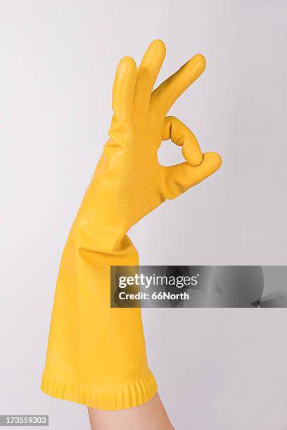 yellow g 1 - rubber gloves stockfoto's en -beelden