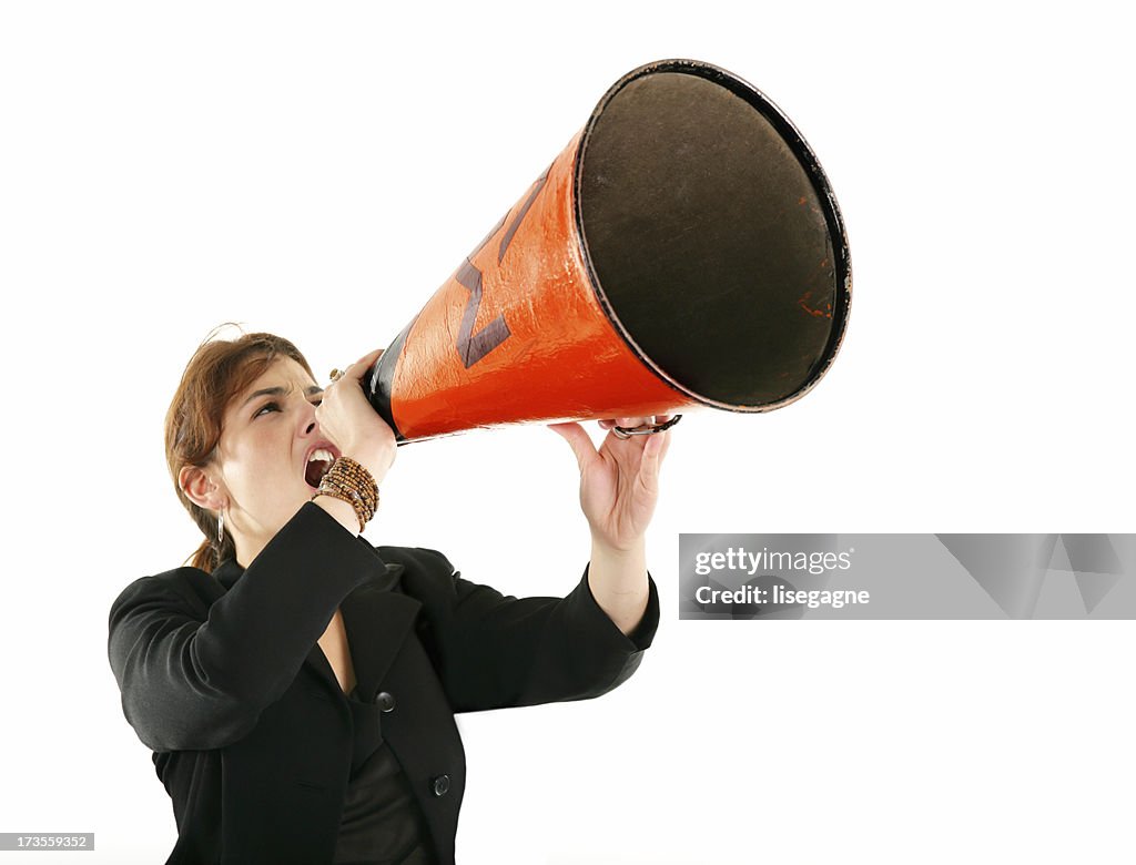 Businesswoman screaming in a megaphone