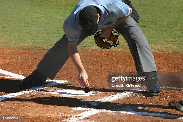 sweeping off the plate - baseball umpire stock pictures, royalty-free photos & images