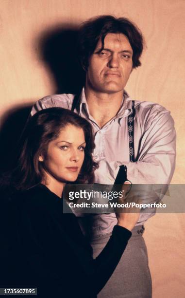 American actress Lois Chiles poses as Holly Goodhead alongside Richard Kiel as Jaws during the promo photo-shoot for the James Bond film Moonraker,...