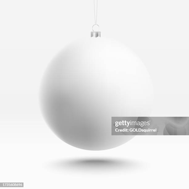 realistic illustration of a christmas tree bauble with 3d effect in vector - minimalistic design in shades of white - one big round object isolated just above white surface, casting a delicate shadow - purity stock illustrations