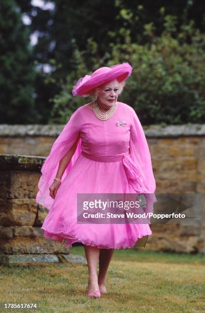 English writer Dame Barbara Cartland , known as "The Queen of Romance", during the wedding of her step-grandson, Charles Spencer at the Church of St...
