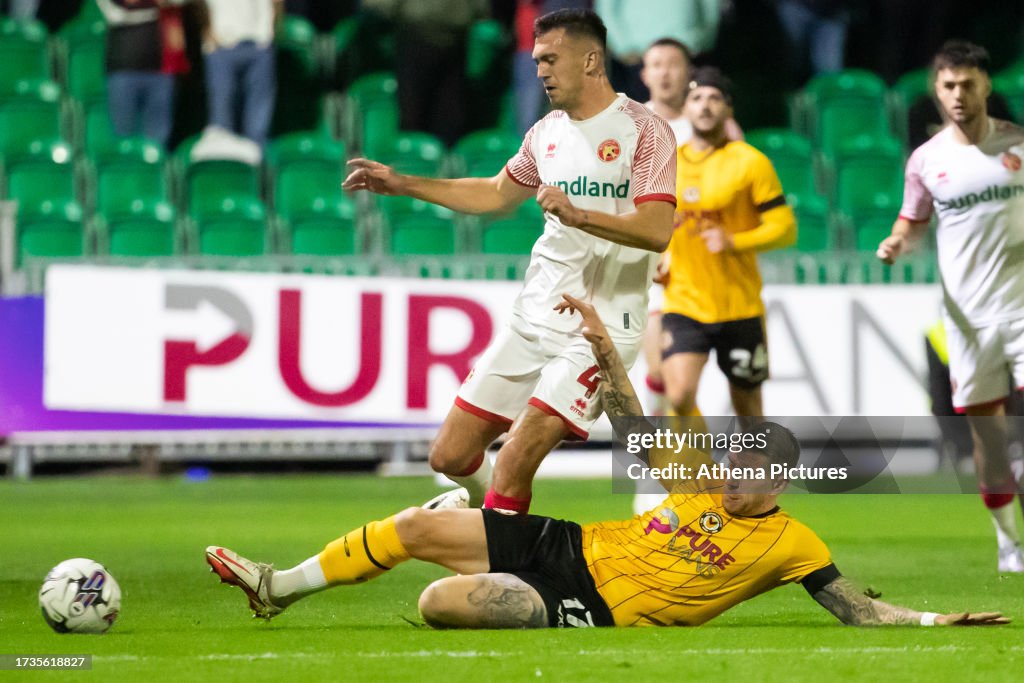 Scot of Newport County tackles Oisin McEntee of Walsall... News