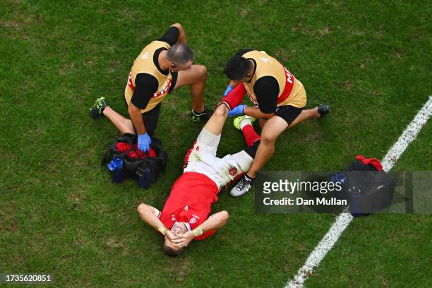 Liam Williams of Wales receives medical treatment during the Rugby World Cup France 2023 Quarter Final match between Wales and Argentina at Stade...