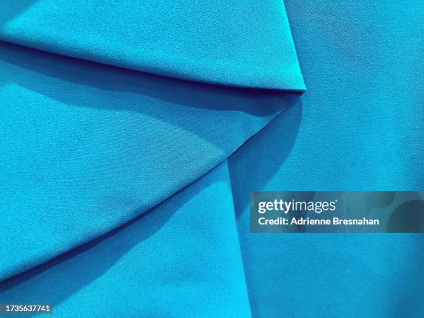 folded blue fabric - linen paper texture stock pictures, royalty-free photos & images