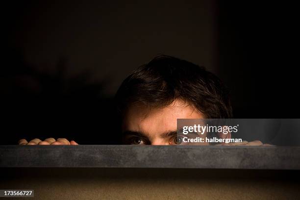 peeking over a cublicle wall - cubicle wall stock pictures, royalty-free photos & images