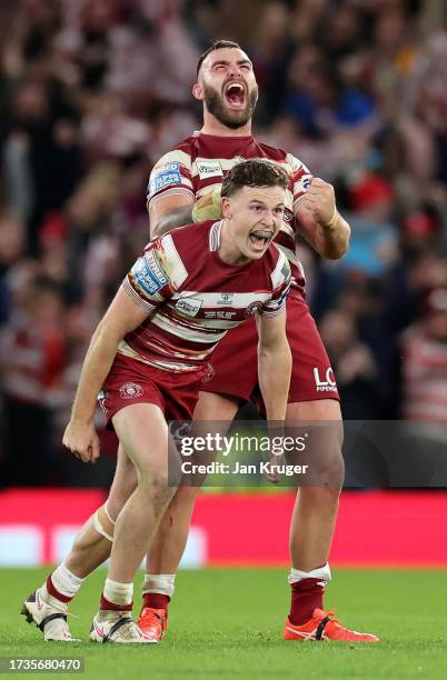 Jai Field and Kaide Ellis of Wigan Warriors celebrate after the team's victory during the Betfred Super League Final match between Wigan Warriors v...