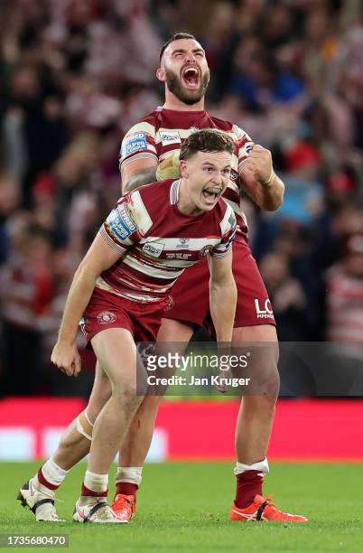 Jai Field and Kaide Ellis of Wigan Warriors celebrate after the team's victory during the Betfred Super League Final match between Wigan Warriors v...