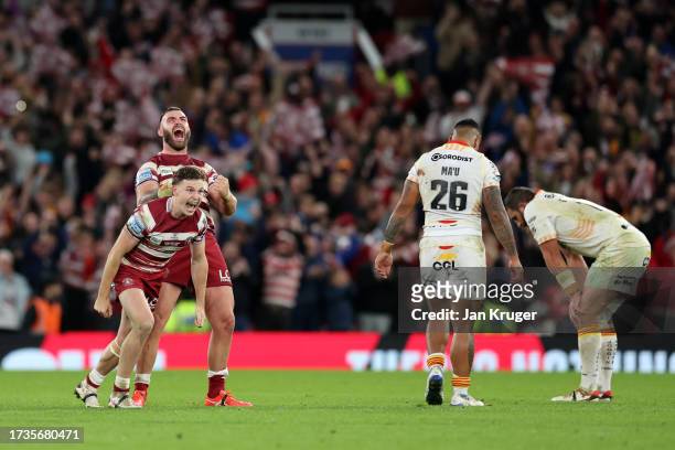 Jai Field and Kaide Ellis of Wigan Warriors celebrate after the team's victory during the Betfred Super League Final match between Wigan Warriors v...
