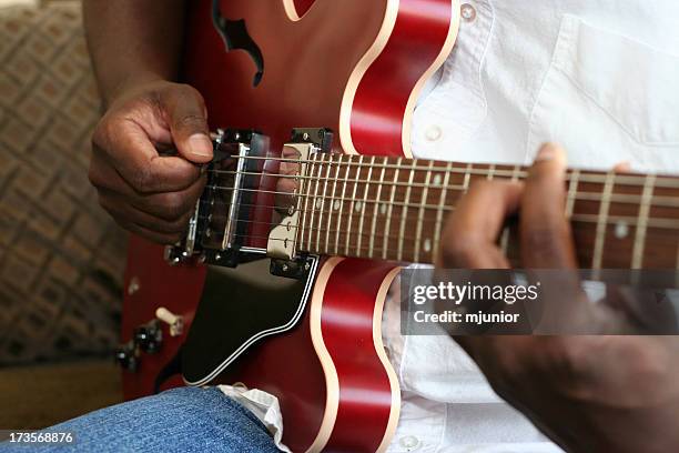 jazz guitar player 3 - red electric guitar stock pictures, royalty-free photos & images