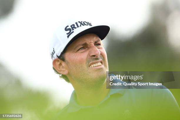 Alfredo Garcia Heredia of Spain watches his shot on the 18th hole on Day Three of the acciona Open de Espana presented by Madrid at Club de Campo...