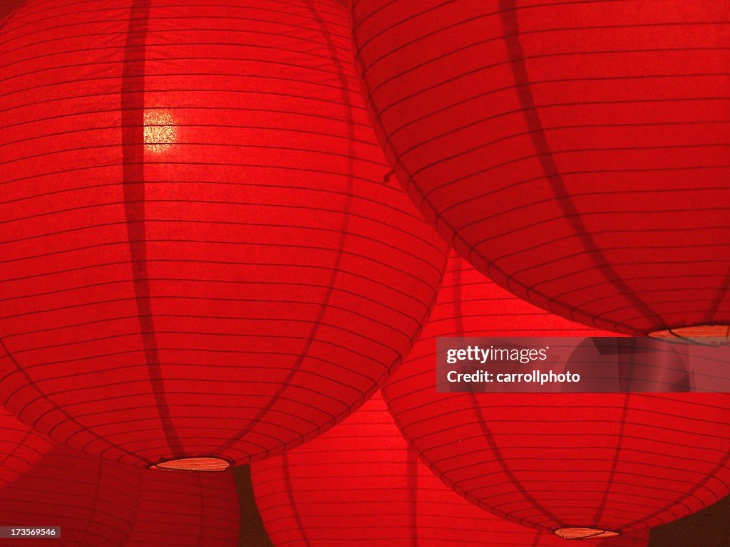 Hanging red paper lanterns glowing