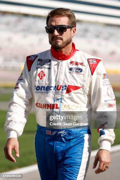 Yeley, driver of the ConectUS Ford, walks the grid during qualifying for the NASCAR Cup Series South Point 400 at Las Vegas Motor Speedway on October...