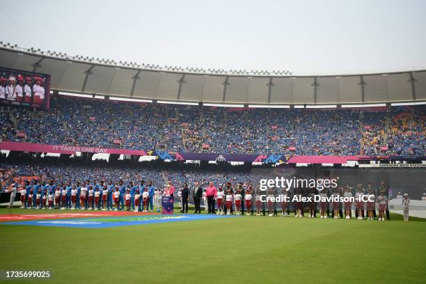 The teams line up for the anthems during the ICC Men's Cricket World Cup India 2023 match between India and Pakistan at Narendra Modi Stadium on...
