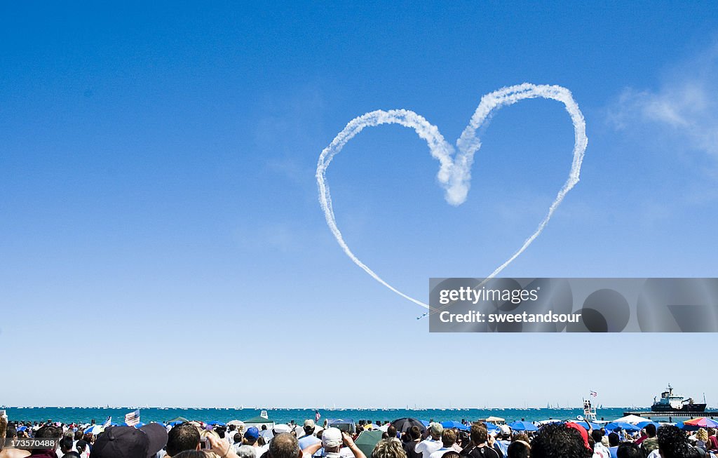 Heart made out of a planes smoke trail