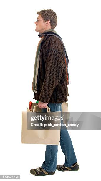 man walks in front of??? - shopping bags white background stock pictures, royalty-free photos & images