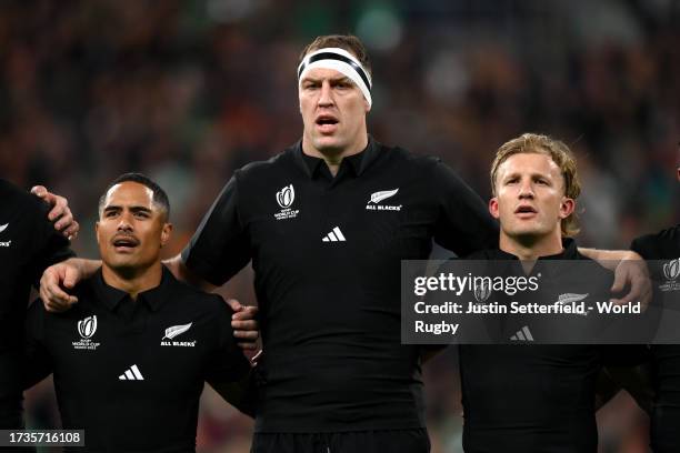 Aaron Smith, Brodie Retallick and Damian McKenzie of New Zealand sing their national anthem prior to the Rugby World Cup France 2023 Quarter Final...