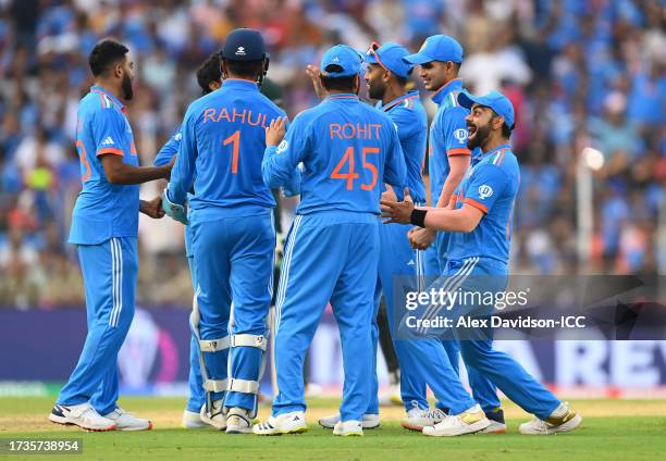 Virat Kohli and India celebrate the wicket of Haris Rauf of Pakistan during the ICC Men's Cricket World Cup India 2023 match between India and...