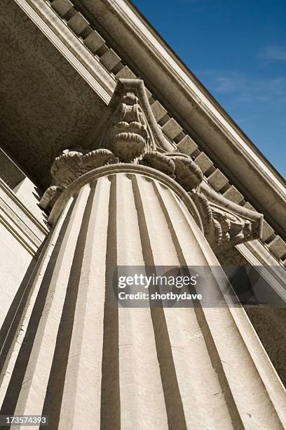 roman column on wall street - government money stock pictures, royalty-free photos & images