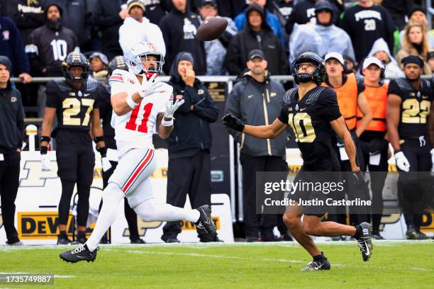Brandon Inniss of the Ohio State Buckeyes catches a touchdown pass while defended by Cam Allen of the Purdue Boilermakers during the second half at...