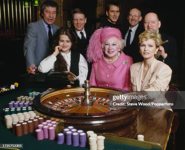 The stars of a new made-for-television romantic drama film taken from a Barbara Cartland book, 'A Hazard of Hearts', gather round a poker table on...